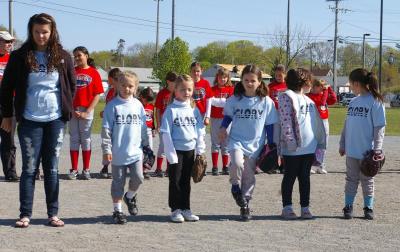 Members of the "Glory," an instructional league team, after all the teams had been introduced field. BY RISHI SIDHU
