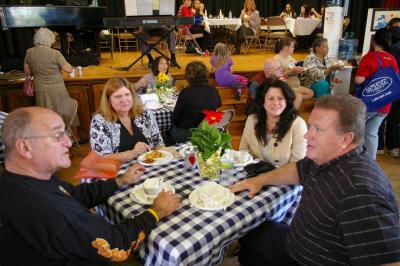 From left to right, Member of the Board of Selectmen Alan Slavin, Library Director Denise Medeiros, Gateway Chamber of Commerce President Patricia Muraco, and Director of Inspectional Services Myles Burke enjoy lunch during the Health Fair. BY RISHI SIDHU