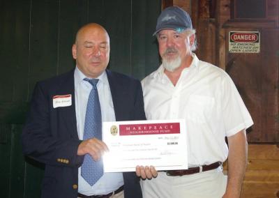 Robert Ethier, Health Agent for the Town of Wareham, and Bob Brady, associate member of the Board of Health, receive a $2,500 grant for the "Cranberry Country Smoke-Free Multi-Unit Housing Initiative." BY RISHI SIDHU