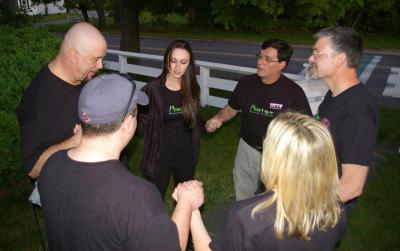 The members of the crew do a "Power of Protection" prayer before starting their investigation into the house. BY RISHI SIDHU