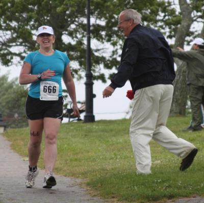 Onset resident Dolores Cleek gets some encouragement from companion Steve Holmes during the race. Holmes serves on the Board of Selectmen. BY JAIME REBHAN