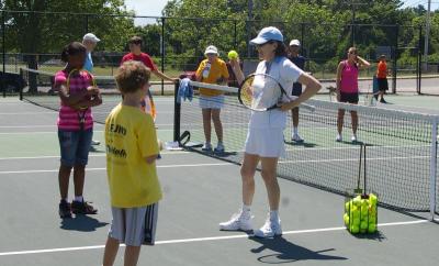 Joanne Byron, coordinator of the clinic, tells the young learners to "keep your eye on the ball." BY RISHI SIDHU
