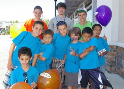 Members of the Boys & Girls Club visited the Wareham Crossing festivities. Top row, left to right: Wareham High School students Adrian Dugre, Nate Strawn, and Christopher Jesus. BY RISHI SIDHU