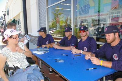 From right to left: Gatemen pitchers Colby Suggs, Barrett Astin, Konner Wade, and Kendall Graveman sign autographs. BY RISHI SIDHU