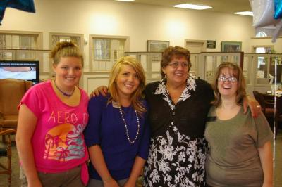 From left to right, volunteer Emily Humfryes, Eastern Bank teller Heather Johnson, Branch Manager Rose Berry, and Senior Customer Service Representative Donna Deitsch. BY RISHI SIDHU