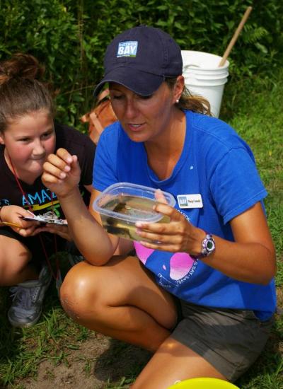 Margo Connolly, Senior Educator with the Buzzards Bay Coalition, quizzes students about tadpole biology during the Coalition's nature walk on Monday, August 6. BY RISHI SIDHU