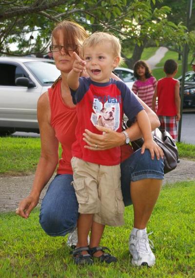 Two-year-old Tyler Cannon of Wareham points out a public safety vehicle to grandmother Mary Klueber. BY RISHI SIDHU