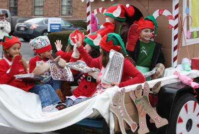 Wareham Girl Scout Troop 81121 traveled with a gingerbread house and trays of cookies. BY JAIME REBHAN
