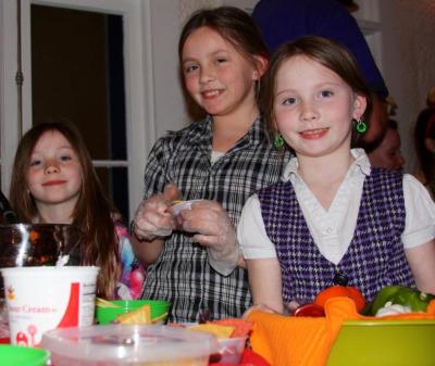 Sisters Julianna, 6, Breanna, 8, and Shannon Franklin, 10, served up dad's (Jim) Firehouse Chili. BY JAIME REBHAN