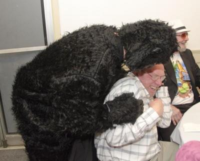 Gorilla hugs were complimentary at the dinner. Here David Hughes got a (friendly?) nuzzle. BY GEORGIA SPARLING