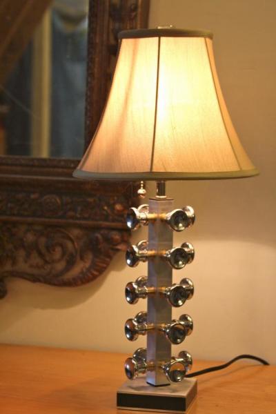 Tom Cassella was inspired by the way the light hits the metal drawer pulls that he used on this lamp, which he calls a "Jux Lamp," short for "juxtaposition." "I bought a thousand of them," he says of the drawer pulls. "I've got plans." The base of the lamp from the Wareham-based Fireslate. BY JAIME REBHAN