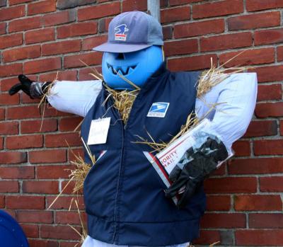 Neither rain nor snow nor gloom of night will keep this scarecrow from his post outside the Onset Post Office. He's complete with snow boots… just in case! BY JAIME REBHAN