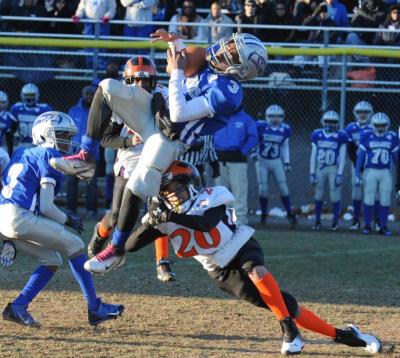 Damien Perry stops Seahawk player two yards shy (on 4th and 12) of the first down on West Haven's final possession. BY JOSEPH SILVIA