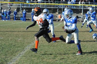 Elijah McAllister runs away from the competition for his second touchdown of the day. BY JOSEPH SILVIA