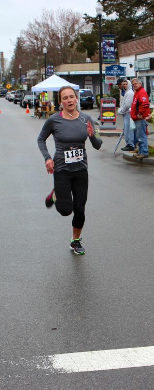 Kristin Burgess of Buzzards Bay took home the first place trophy for the Women's Division on Sunday. BY NICK WALECKA