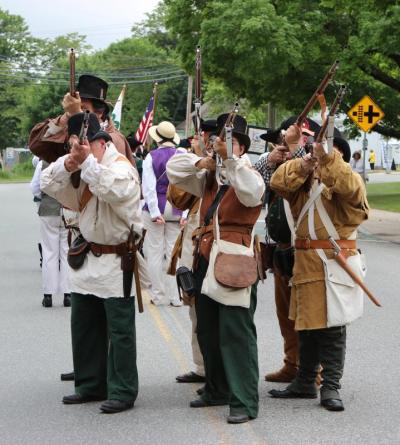 Members of Wareham's Minuteman Militia do through drills prior to Saturday's battle on Town Green. BY NICK WALECKA