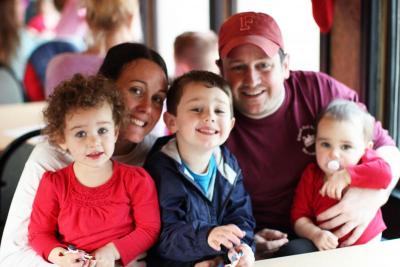 The Griffins -- Elizabeth, Tammie, Patrick Jr., Patrick, and Faith -- enjoying the Holiday Train. BY NICK WALECKA