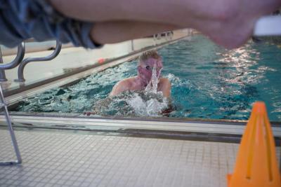 Gray Curtis begins another lap in a special lane of the Swim-a-thon. Curtis swam three nautical miles (almost three and a half normal miles), choosing to do so, because of his Navy background. BY CAROLYN BICK