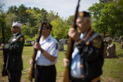 From left to right, Arthur Lee, John Monteiro, and Joe Capello stand in St. Patrick's Cemetery. BY CAROLYN BICK