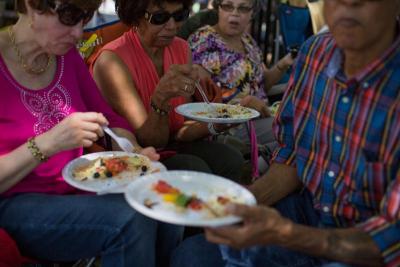 A family enjoys a mix of home-cooked Cape Verdean and American food they brought to the festival. BY CAROLYN BICK