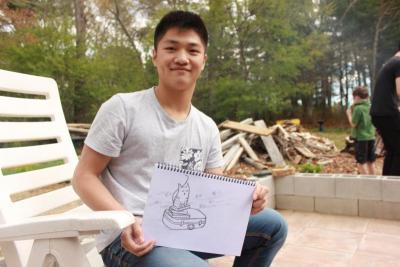 Jiaje Wu holds up a drawing he did. He's been drawing since he was six years old, and has taken lessons in the past two years. He enjoys art and design. BY ZARRIN TASNIM AHMED