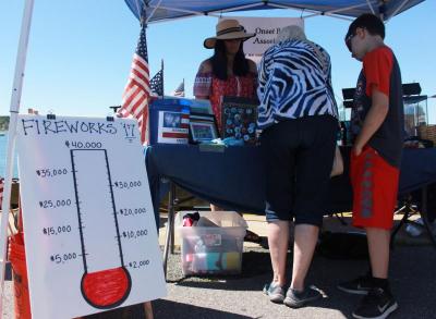 The Onset Bay Association, who partnered in creating the event, manned a booth and sold buttons, t-shirts, and other things to raise funds for next year's fireworks. BY ZARRIN TASNIM AHMED