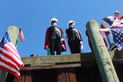 Members of the Knights of Columbus Bishop Cassidy Assembly, 4th degree, salute the boats. BY ZARRIN TASNIM AHMED