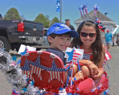 From left: Will, 4, and Ava, 9, Regan spend their summers in Onset, and were dressed up along with their carriage for the parade. They won first place for carriages. BY ZARRIN TASNIM AHMED