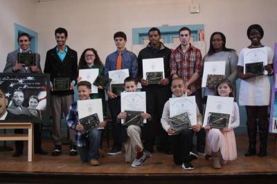Spirit Award winners show off their plaques and certificates of appreciation at the end of the ceremony. Back row from left: Jordan Phillips, Teddy Mathews, Riley Gomes, Curtis Briggi, James Thomas, Antony Alford, D'Asia McCane, Miata Bawoh. Front row from left: Rija Rakotoarimanitra-Bunting, Andrew Quinn, Joshua Pulley-Ferguson, Kaylie McKay. BY MATTHEW BERNAT