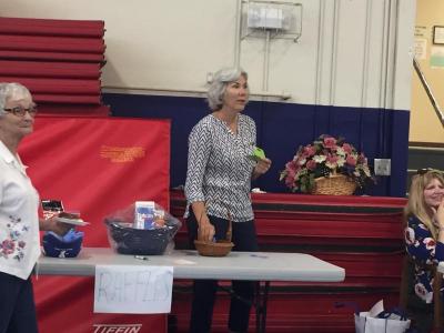 Missy Dziczek, the Council on Aging director, announces raffle numbers to an excited group at the Multi-Service Center. BY LYDIA GOERNER