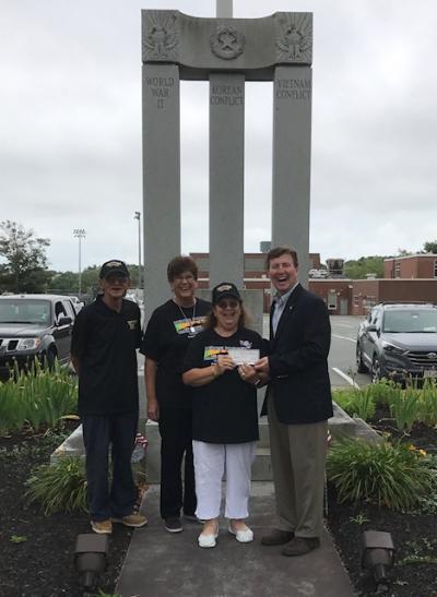 Jerry McDermott, Eversource Community Relations & Economic Development Specialist presents a $1,000 Eversource grant to Friends of Wareham Veterans Council Vice President Ted Pemberton, Treasurer Ilene Klaver and President Jean Sarnelli.The group learned this week that the state budget includes a $25,000 earmark for the Moving Wall. COURTESY FRIENDS OF THE WAREHAM VETERANS COUNCIL