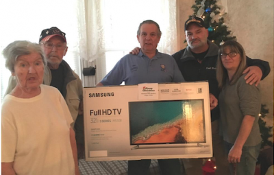 Kendrick House residents accept a new television purchased with money raised by Wareham-New Bedford Lodge of Elks No. 73 members. From left: veteran Jean Wajer, veteran Walter Priestner, Veterans Committee Chair Ed Liffierrec and Carrie King, Kendrick House manager. COURTESY WAREHAM-NEW BEDFORD LODGE OF ELKS NO. 73