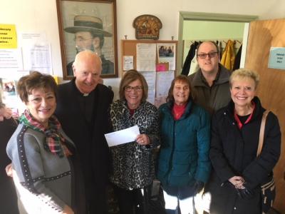 Tobey Hospital Guild President Joan Martin presents Father Columban Crotty, President of Damien’s Pantry, with a check to help purchase food for those in need in the greater Wareham community this holiday season. In the photo (from left) are Agatha St. Amour, Southcoast Hospital Liaison; Father Crotty; Martin; Lois Straffin, Team leader at Damien’s Pantry; Rev. Robert Ripley, Damien’s Pantry volunteer; and Elena Coffey, Tobey Hospital Guild Vice President.