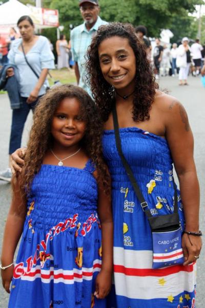 Fressia Jones, left, of Onset and Rochelle Cardoza of Falmouth show off their Cape Verde-inspired dresses. BY MATTHEW BERNAT