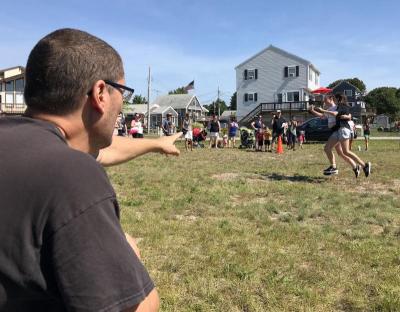 Michael Pilleri watches the finish line to see who won the three-legged race on Sunday. Photo by: Matthew Bernat