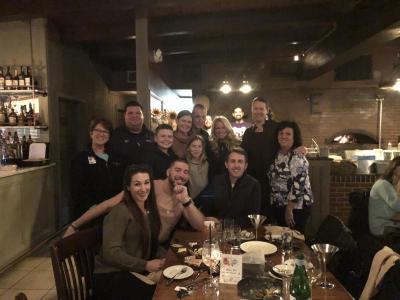 Jill Fearons with the owners of Ella’s Wood Burning Restaurant in Wareham. Far left: Tricia grime from Southcoast Health, seated, far left, Abby from Fun 107, seated, far right, Michael Rock from Fun 107, Jill Fearons, standing, third from right, and Ella’s owners Marc and Jean Cohenno, fourth and fifth standing from right. Photo courtesy: Jill Fearons