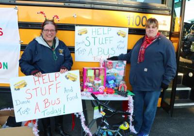 Marie Ferreira and Lori Ellis have been collecting toys for six hours on cold Saturday. Photo by: Nadya Korytnikova