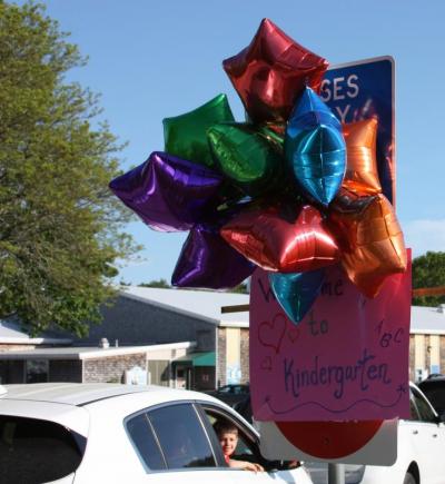 The entrance to the school’s driveway was decorated with balloons and a sign reading, “Welcome to Kindergarten!”