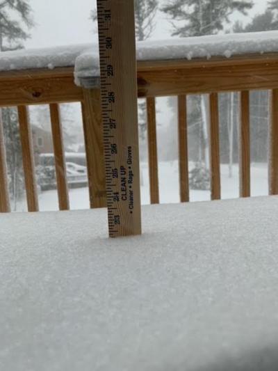 The snow, as measured by this low tech but highly effective ruler, almost hits the top of the deck at Blackmore Pond Road in West Wareham. Photo submitted by: Kristin Anderson