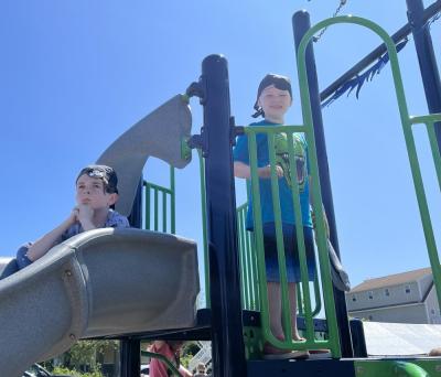 Seven-year-old Jaxson Martin, right, enjoys the playground, while 9-year-old Mason Ecker takes in the view.