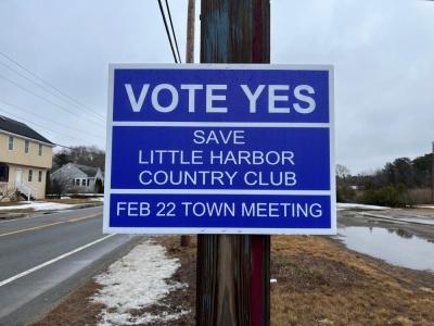 This sign, posted outside the driving range on Sandwich Road, shows community involvement in the community preservation committe’s quest to purchase Little Harbor Country Club and preserve the property. File photo
