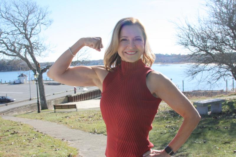 Mimi Secor flexes, showing off her bodybuilding arms. BY LYDIA GOERNER
