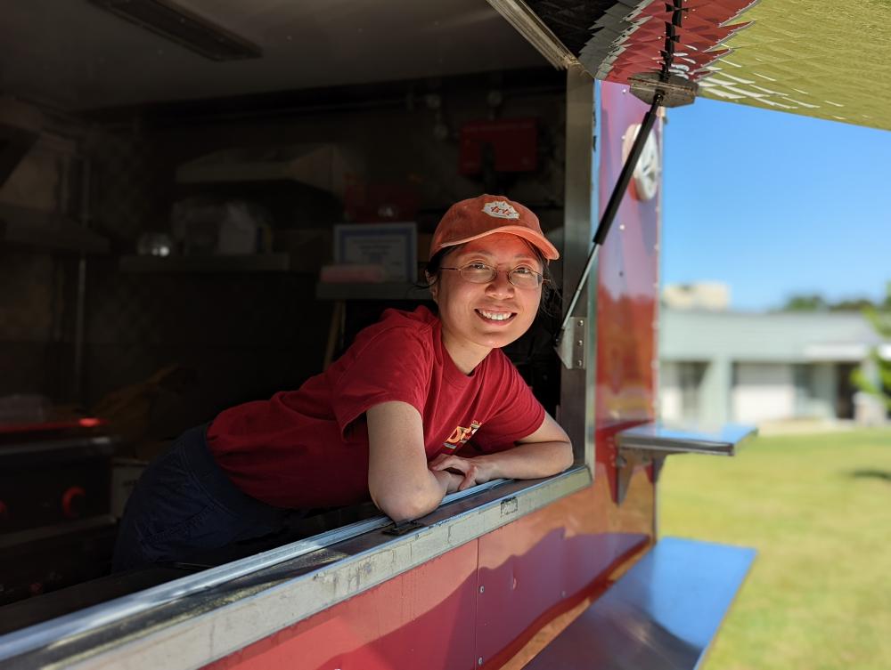 Lee leans outside her food truck.