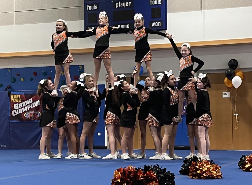 The Midgets sideline cheer team showed great teamwork.