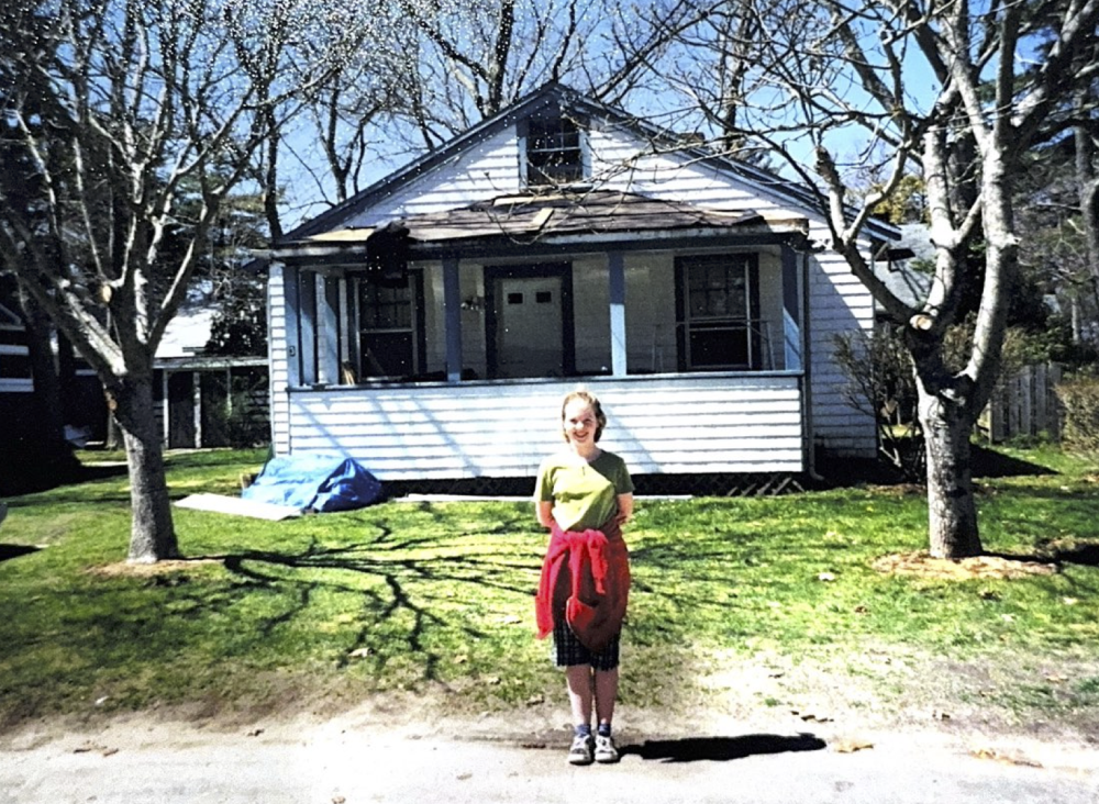 Grace Morrison stands in front of her grandparents’ former home on Datewood Street in the Parkwood Beach neighborhood of Wareham in this earlier photo. The home is referenced in her song, “Only a Man”. Photo courtesy: Grace Morrison