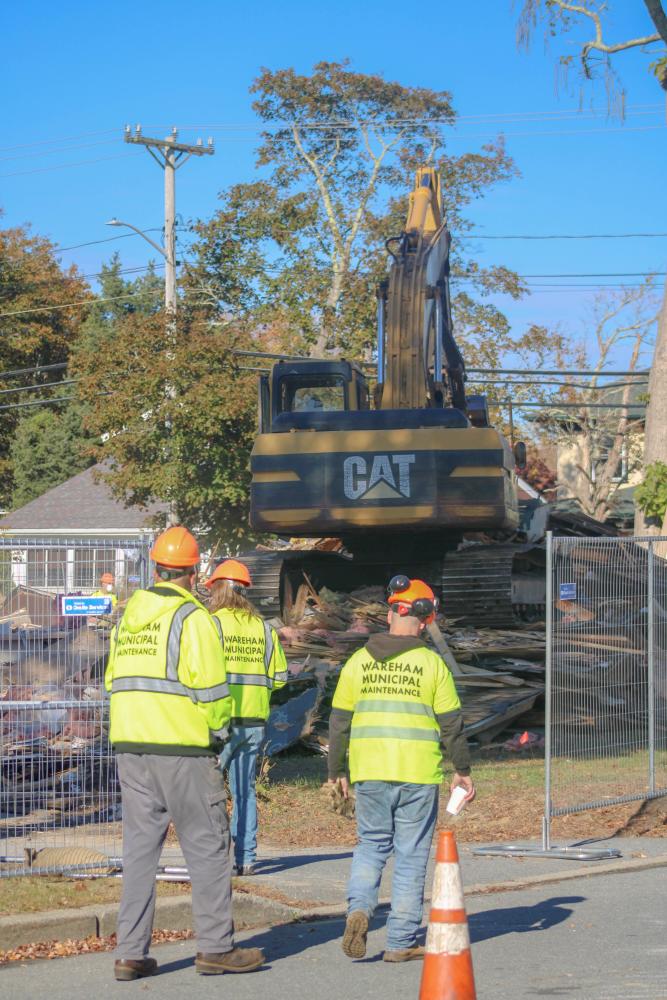 Wareham Municipal Maintenance looks on into the demo. Photo by Brandy Muz Wareham Municipal Maintenance looks on into the demo. Photo by Brandy Muz