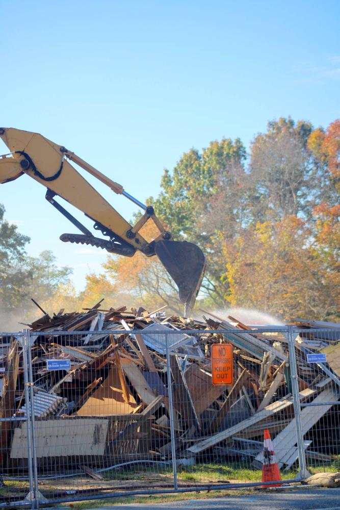 The demo took down the two-story home. Photo by Brandy Muz The demo took down the two-story home. Photo by Brandy Muz