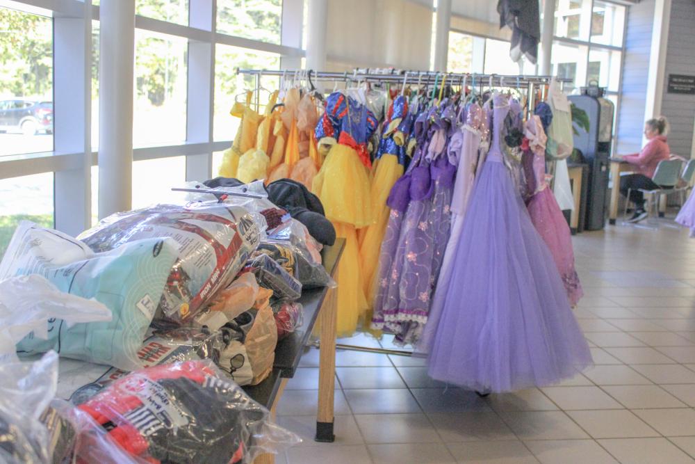 Costumes line the tables and racks. Costumes line the tables and racks.