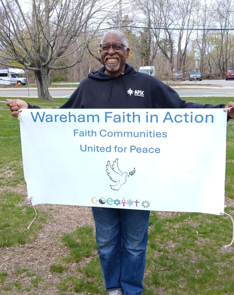 Wareham Faith and Action member beams with a banner. Photos source: Nancy Cushman Rice