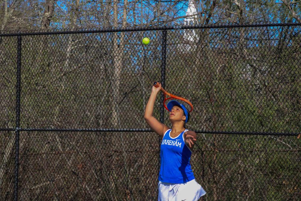  Julianna Frye serves during a home game against Old Rochester on May 1. Photos by Grace Roche